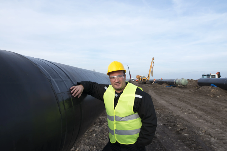 portrait-oilfield-worker-standing-by-gas-pipe-construction-site